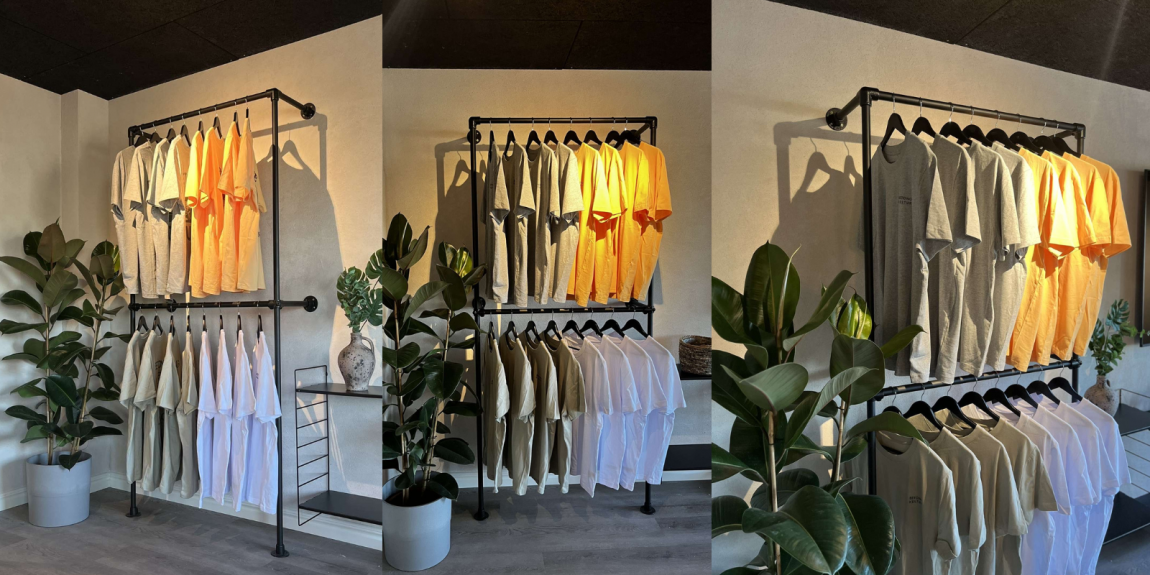 Hemmabyggd klädställning i svart av key clamp rörkopplingar och svarta stålrör